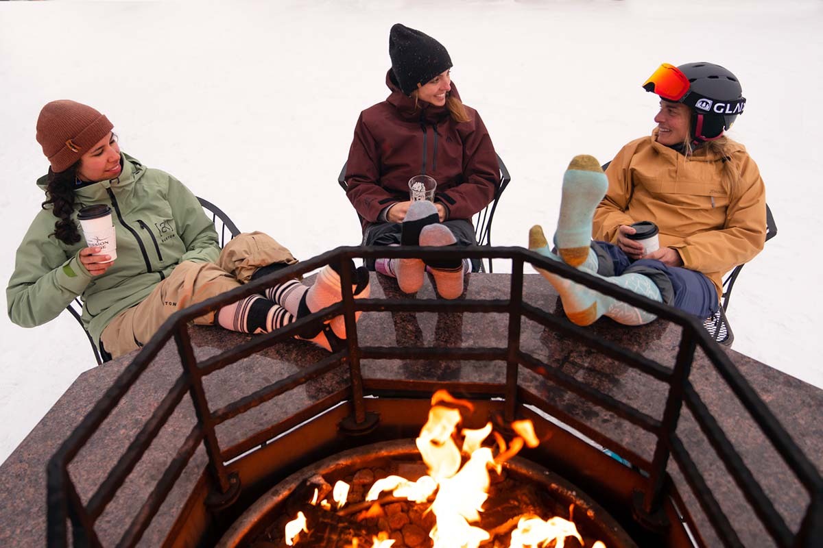 Snowboard pants and jackets (sitting around fire at lodge)