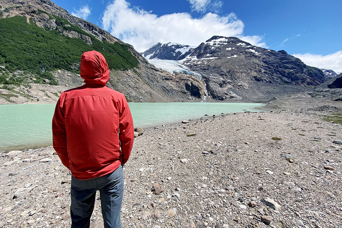 Patagonia Houdini Air windbreaker jacket (standing in front of glacier and lake)