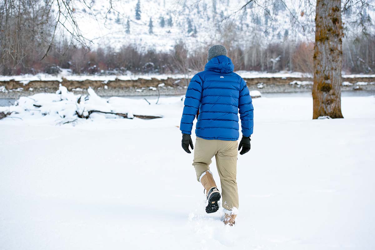 Sorel Caribou winter boot (walking in snow behind)