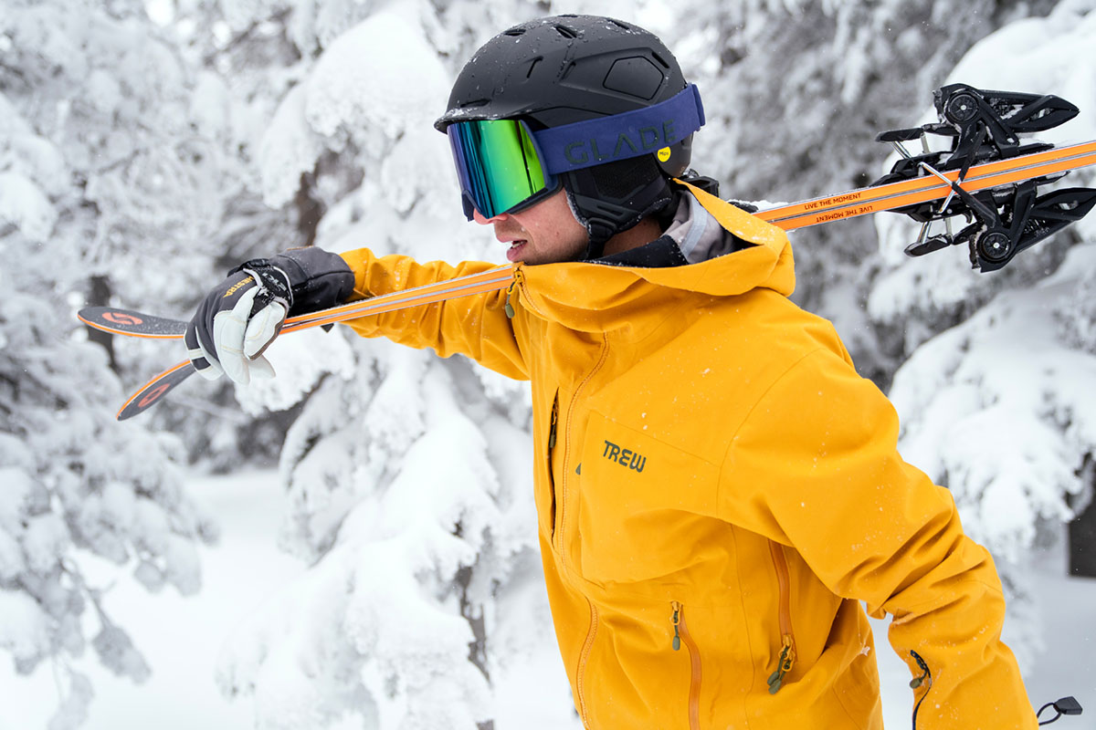 Trew Gear Cosmic Primo Jacket (carrying skis over shoulder)