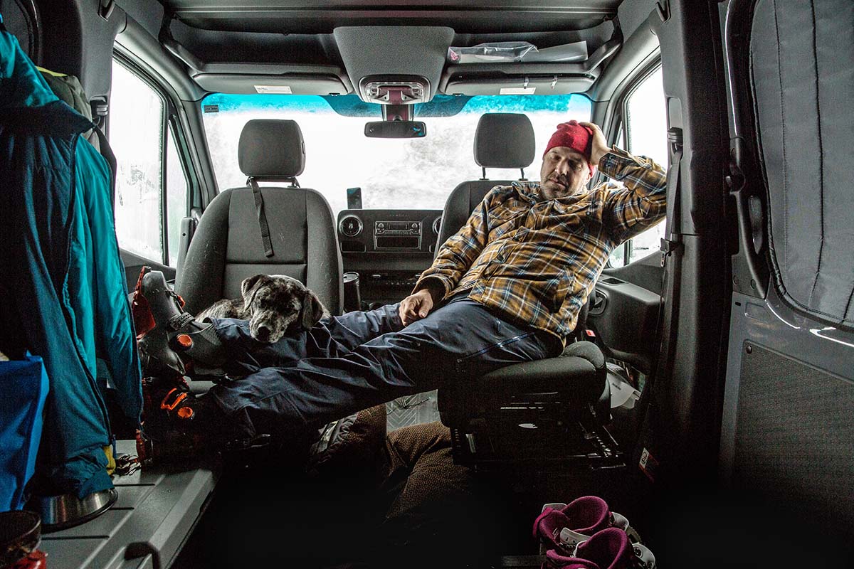 Sleeping in front seat of van with dog