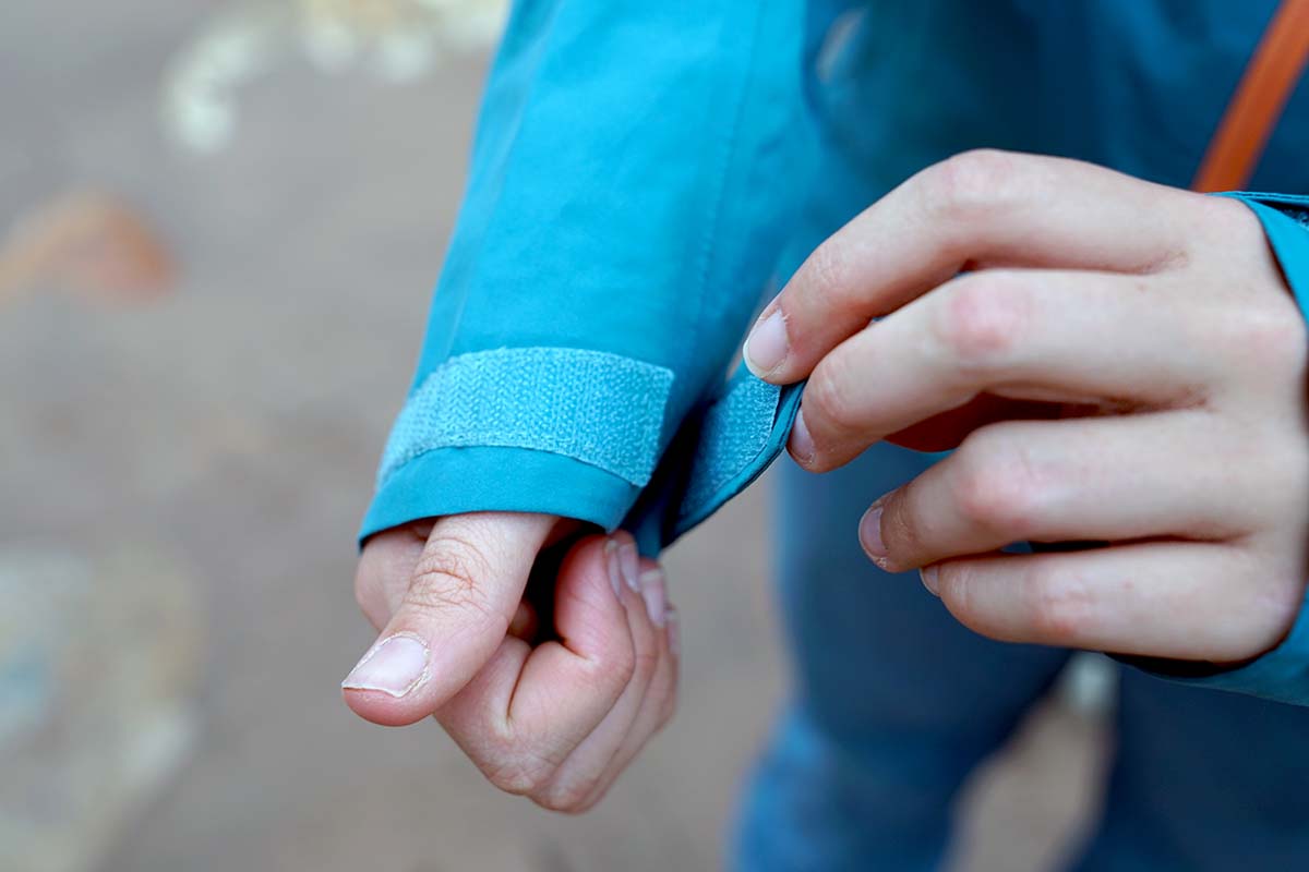 Adjusting cuff on Patagonia Calcite rain jacket