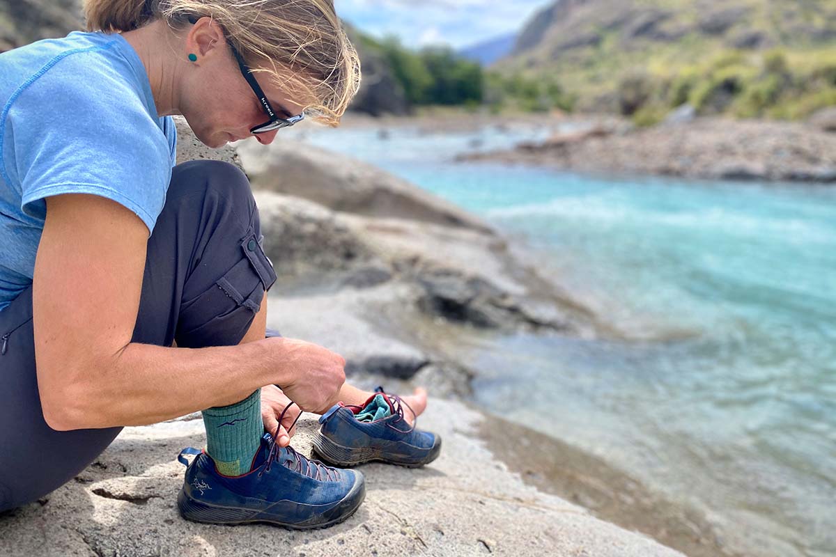 Arc'teryx Konseal FL approach shoes (lacing up by river)
