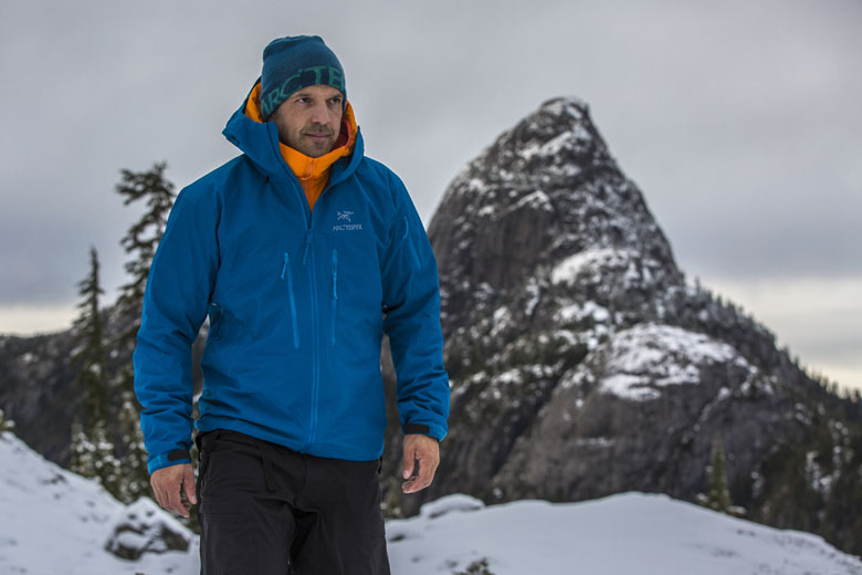 Arc'teryx Alpha SV hardshell jacket (mountain backdrop)
