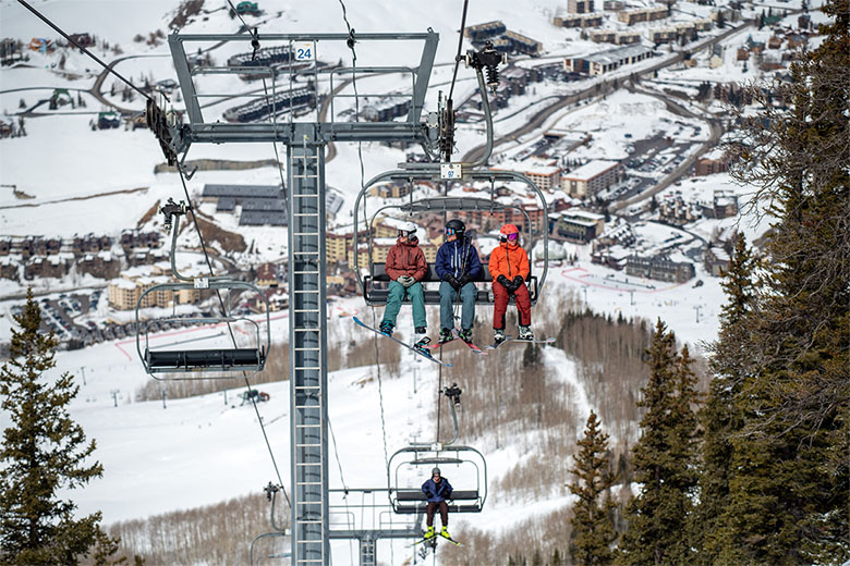 REI Co-op End of Season Clearance (sitting on chairlift at ski resort)