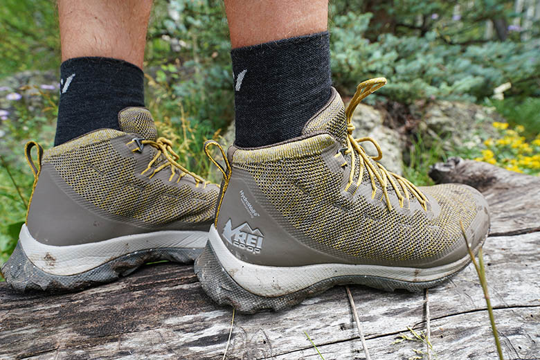 REI Co-op Flash hiking boots (standing on log)