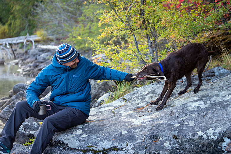 REI Co-op Stormhenge Down Hybrid Jacket (playing with dog by lake)