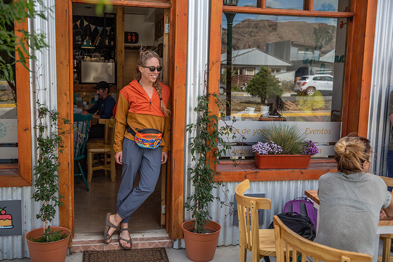 Women's travel pants (standing in cafe wearing Vuori Miles Jogger)