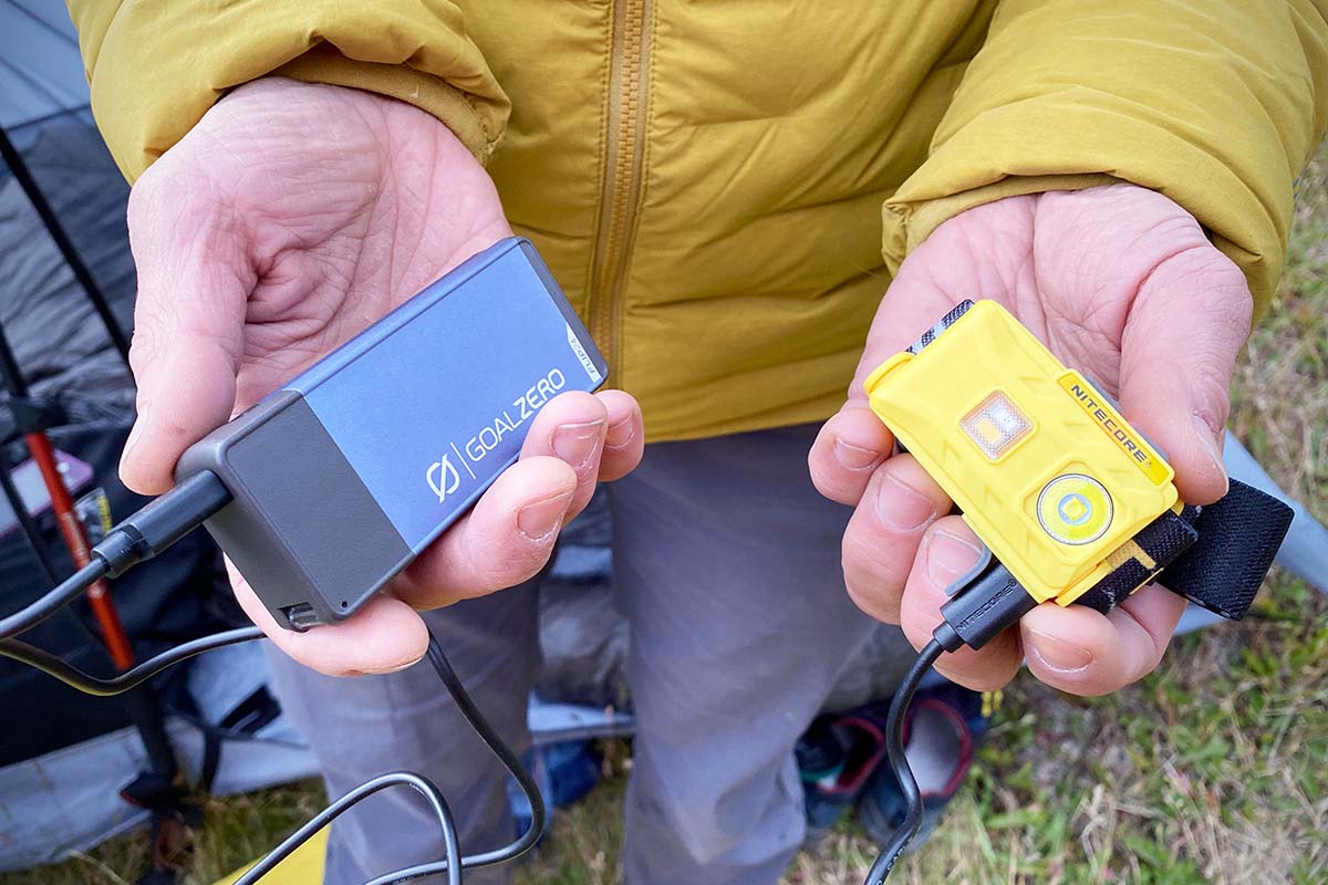 Nitecore NU25 headlamp charging on portable power bank