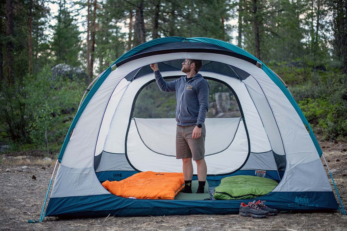 Camping tent (REI Base Camp 6 standing inside)