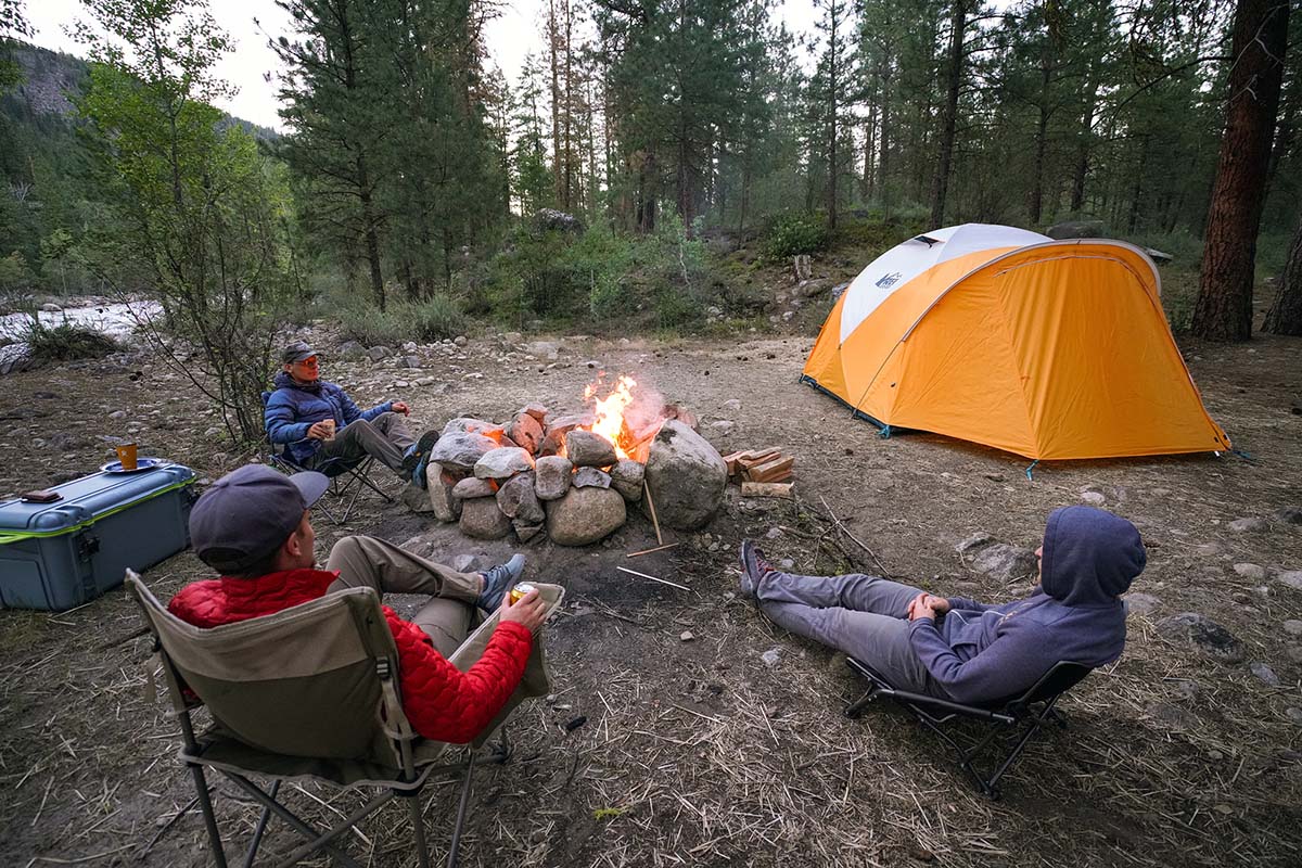 Camping tent (sitting around campfire next to REI Base Camp 6)