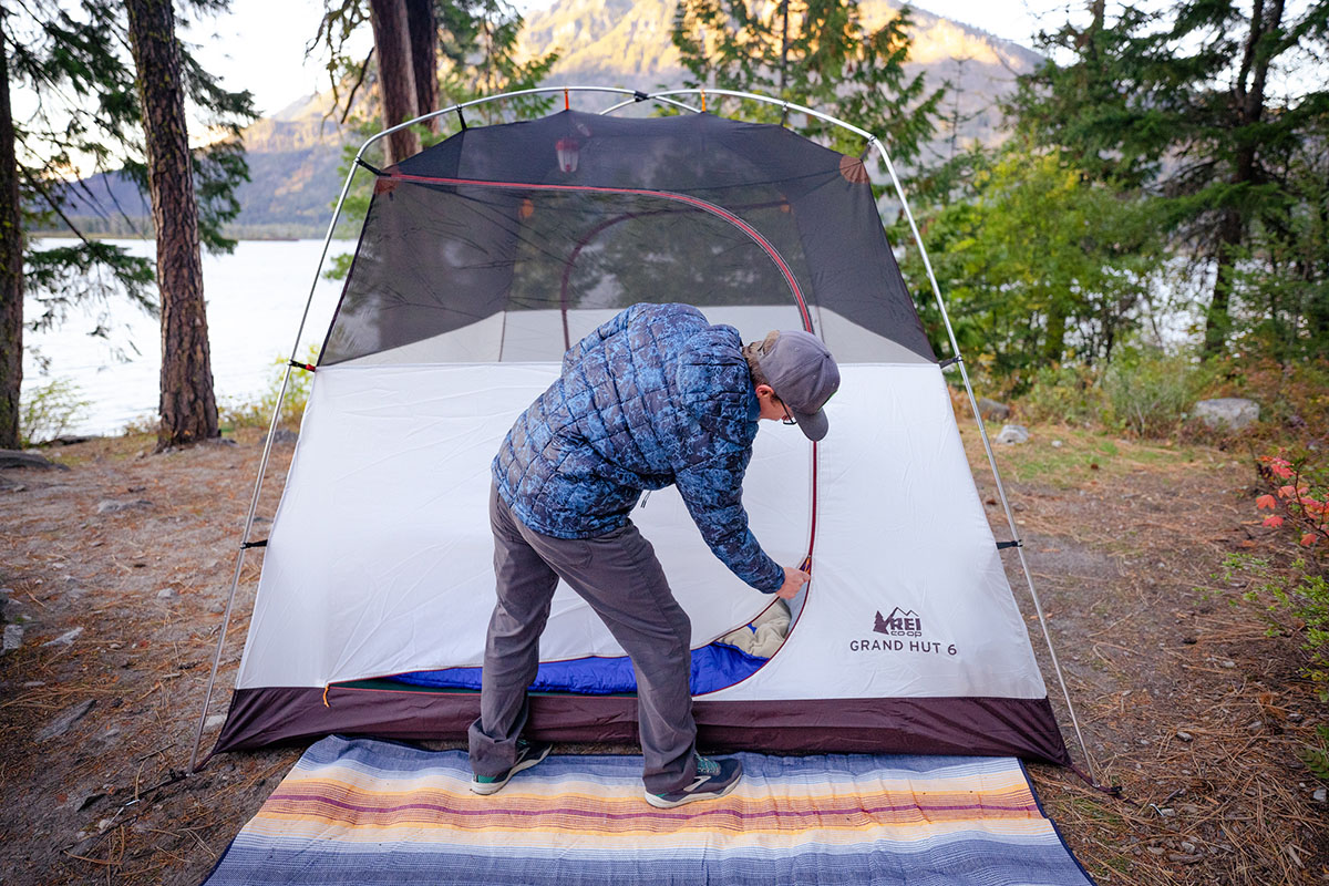 Camping tent (zipping up REI Grand Hut 6)