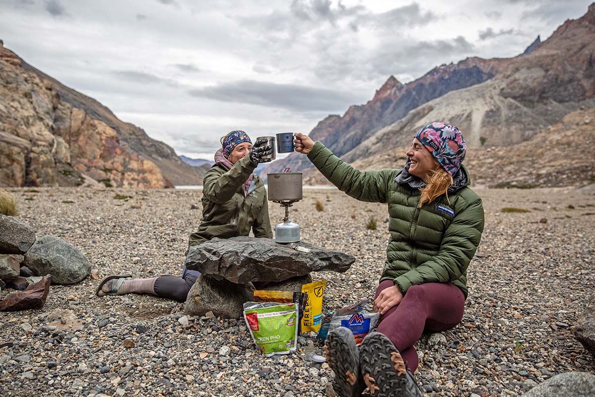 Cheers around backpacking stove in Patagonia
