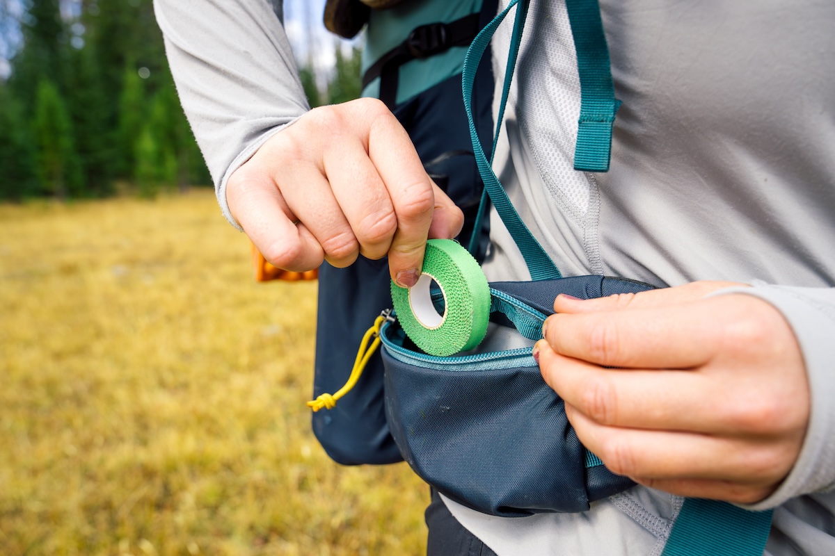Backpacking Backpacks (putting tape in a hipbelt pocket)