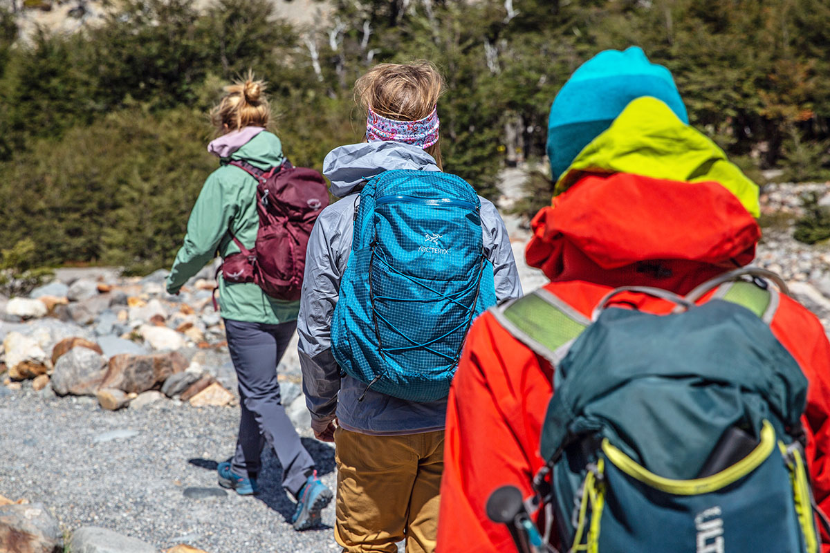 Hiking daypacks (group hiking along riverbed)