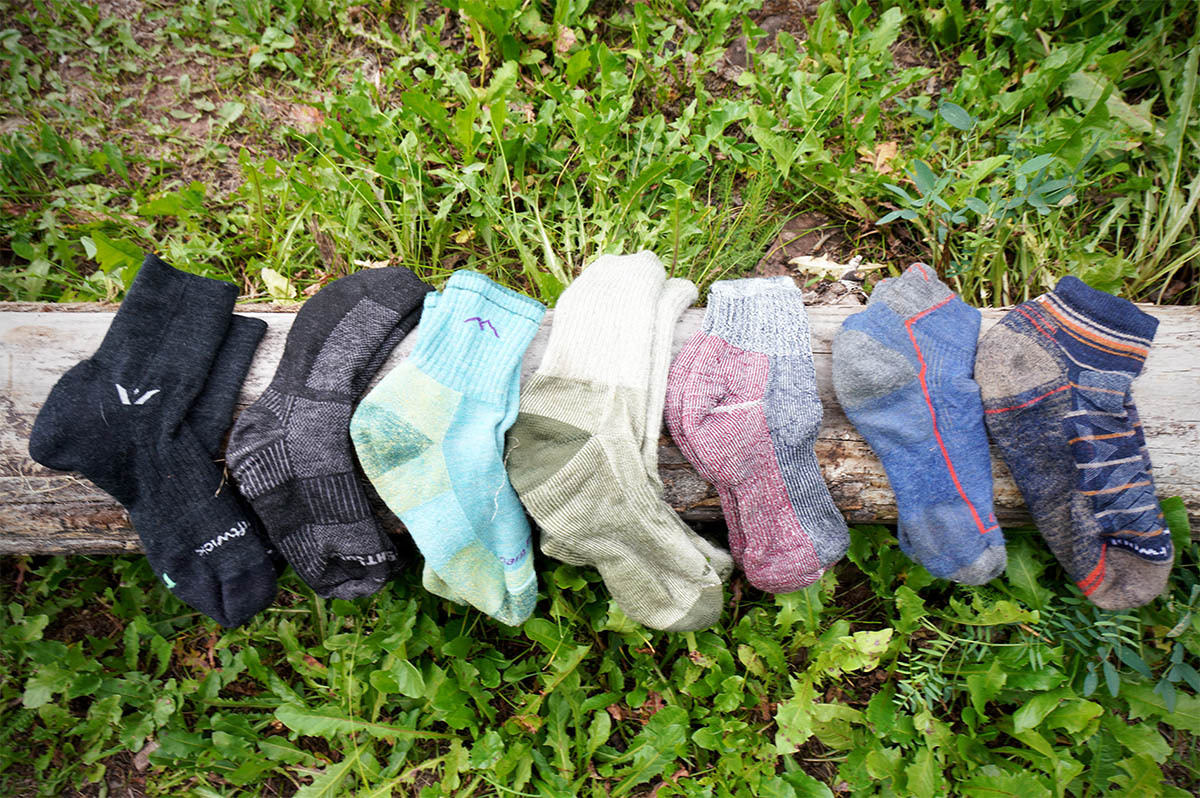 Hiking socks (lineup of socks on log)