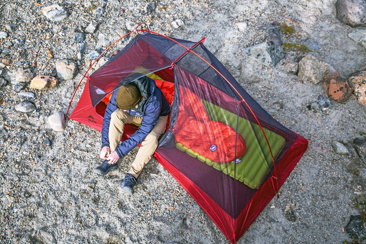 Overhead view of man in backpacking tent