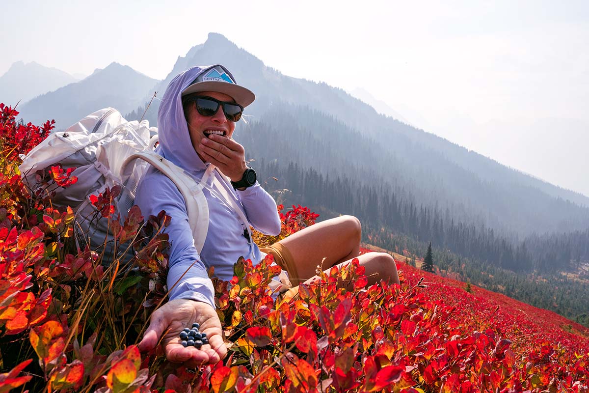 Eating huckleberries in field (sun shirt)