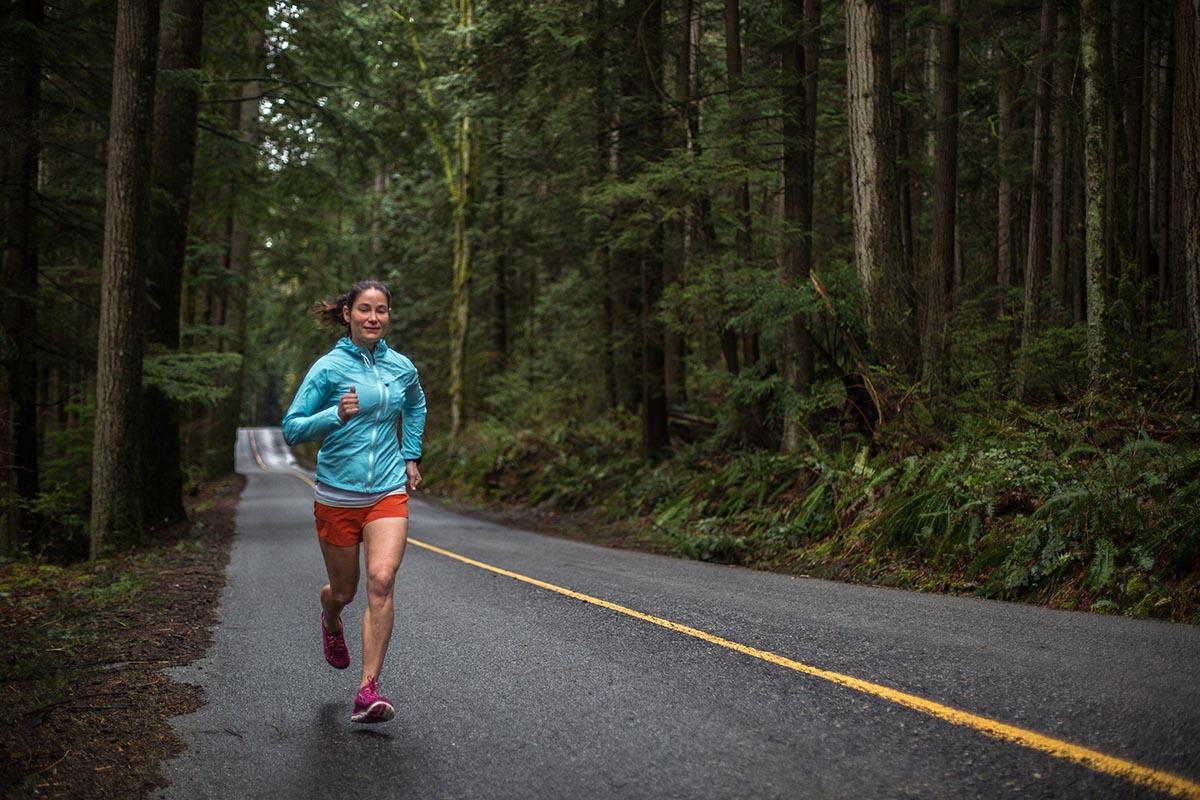 Running on the road through a forest