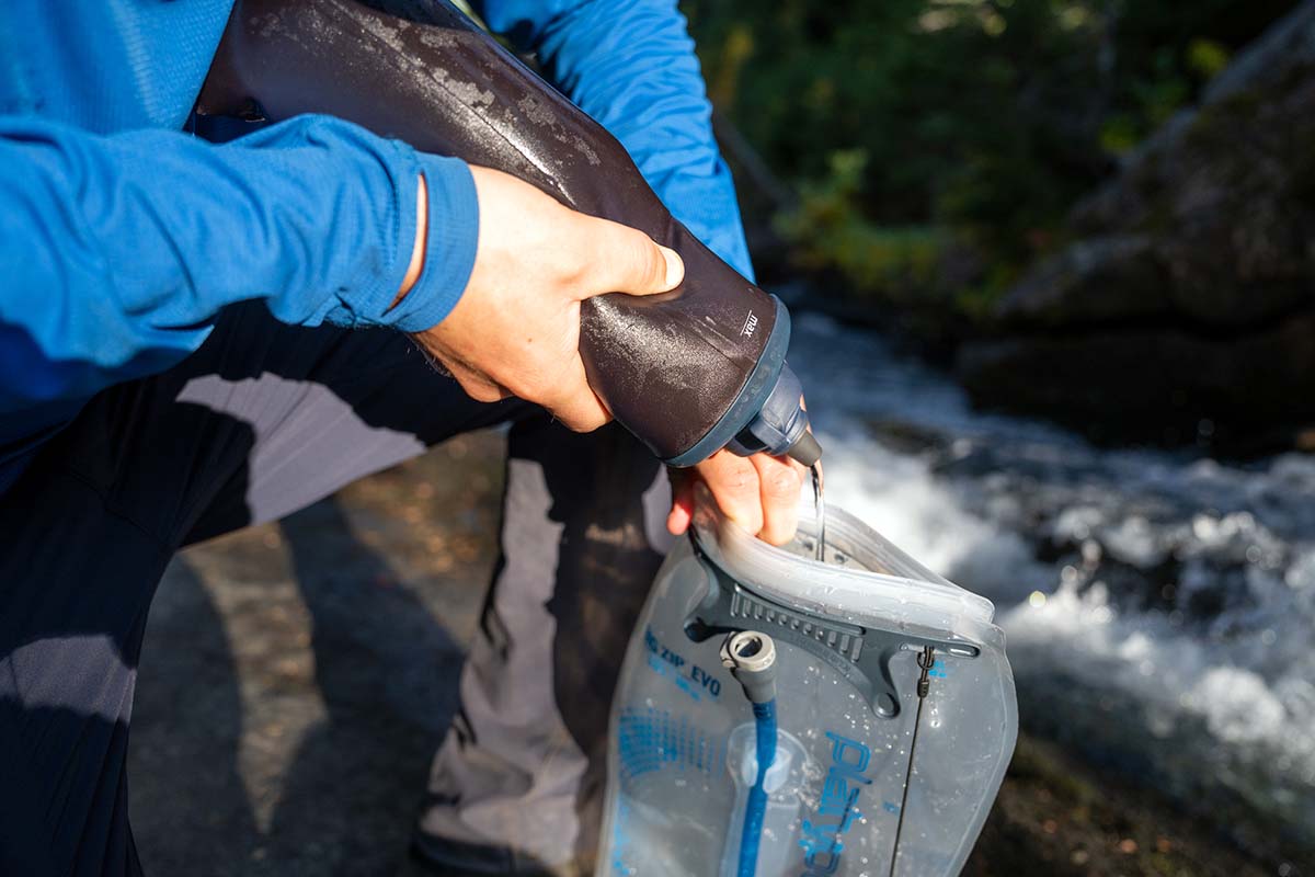 Filling hydration reservoir with LifeStraw Peak Squeeze water filter