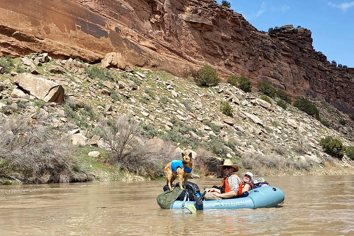 Dog on Kokopelli packraft (floating river in desert)