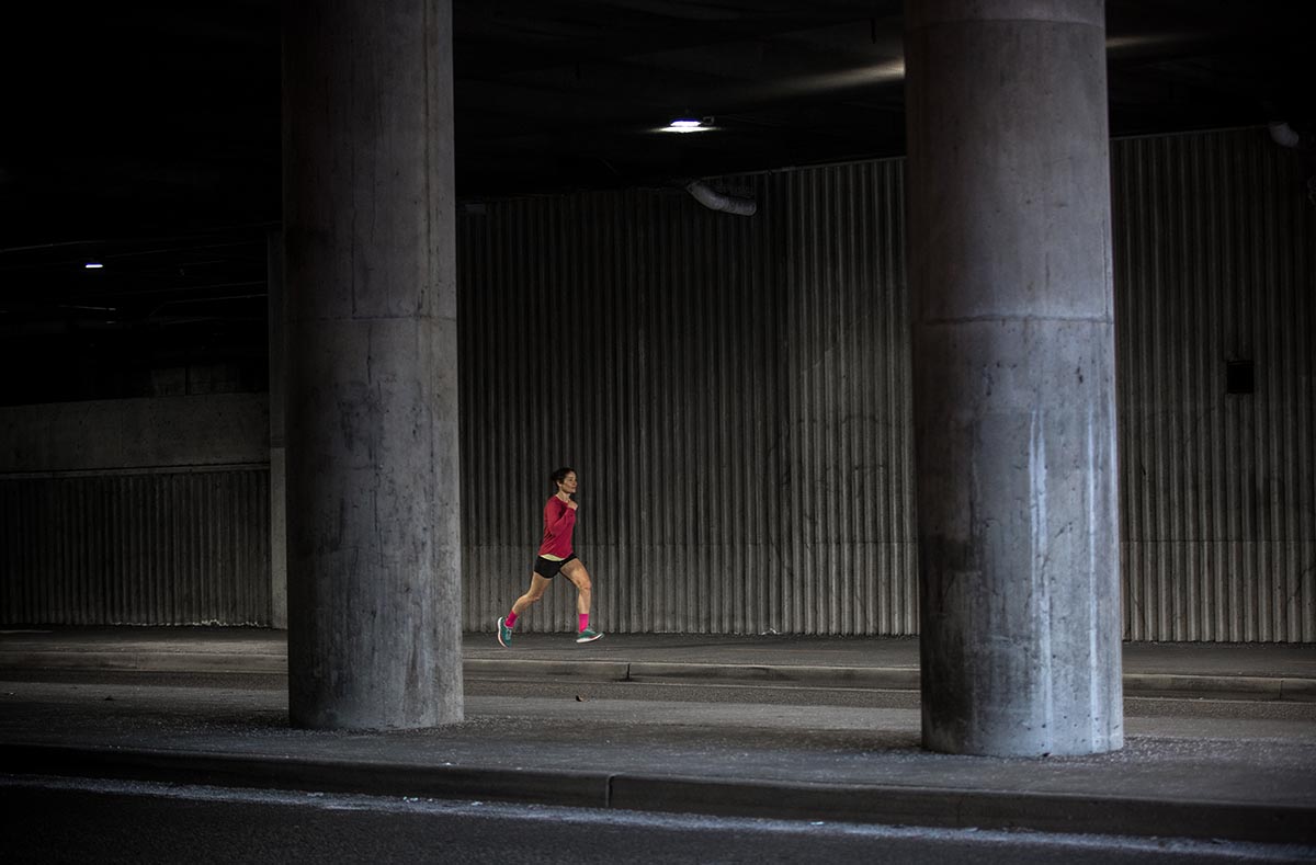 Running shoes (running on pavement under highway)