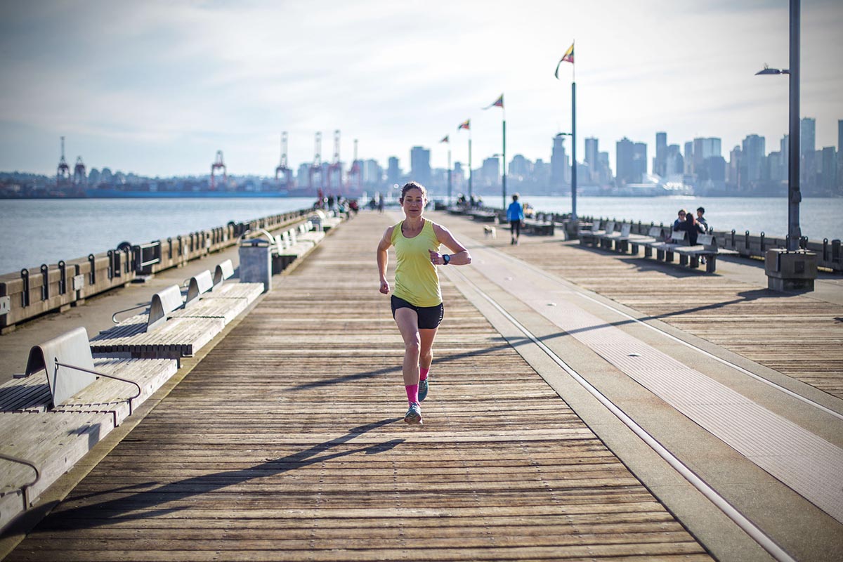 Running on bridge in city (Hoka One One Clifton)