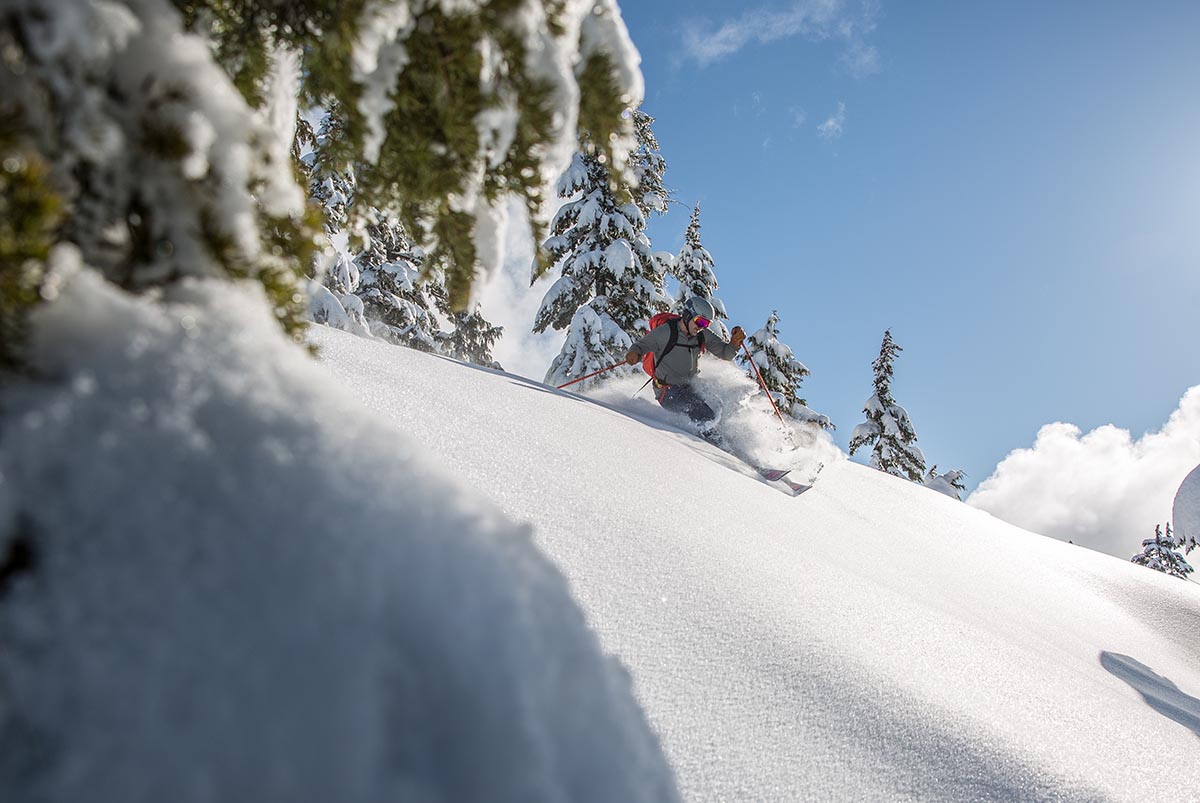 Backcountry ski boots (Rossignol Alltrack Elite turning in powder)