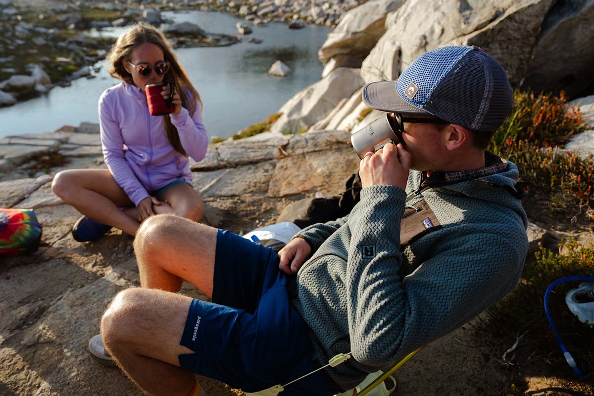 Drinking coffee at camp (fleece jackets)