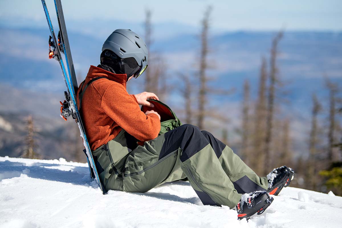 Black Diamond Recon ski Bibs (sitting in snow)