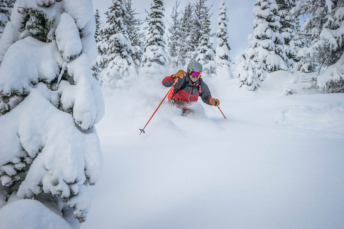 Skiing downhill in powder (ski helmets)