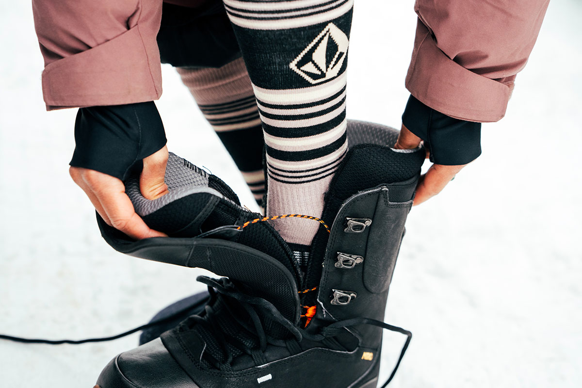 Snowboard socks (putting on snowboard boots)