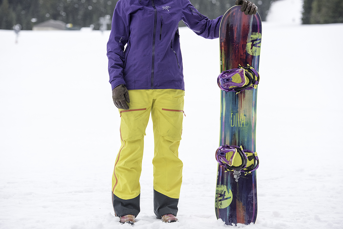 Snowboard gear (standing next to board)