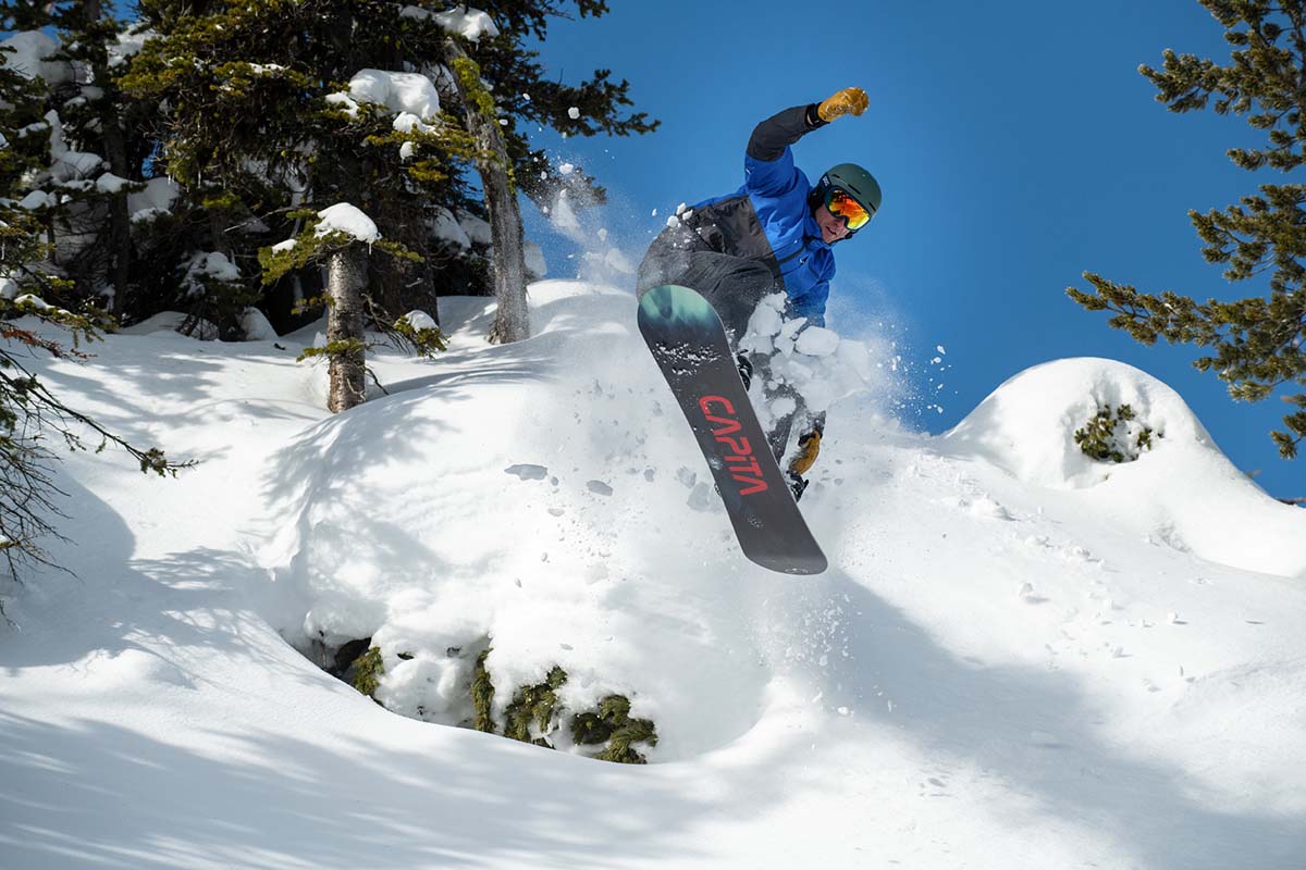 Catching air while snowboarding (leather mittens)