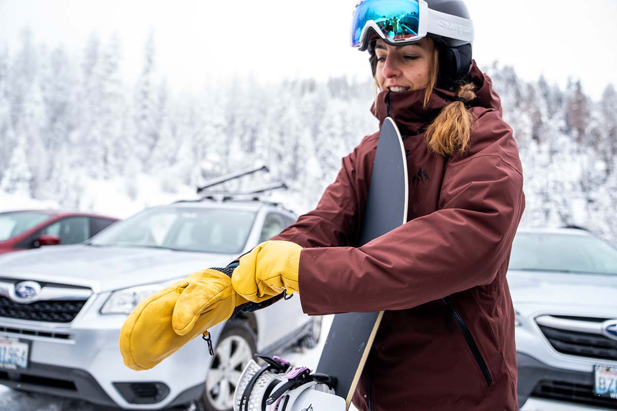 Putting on leather snowboard mittens