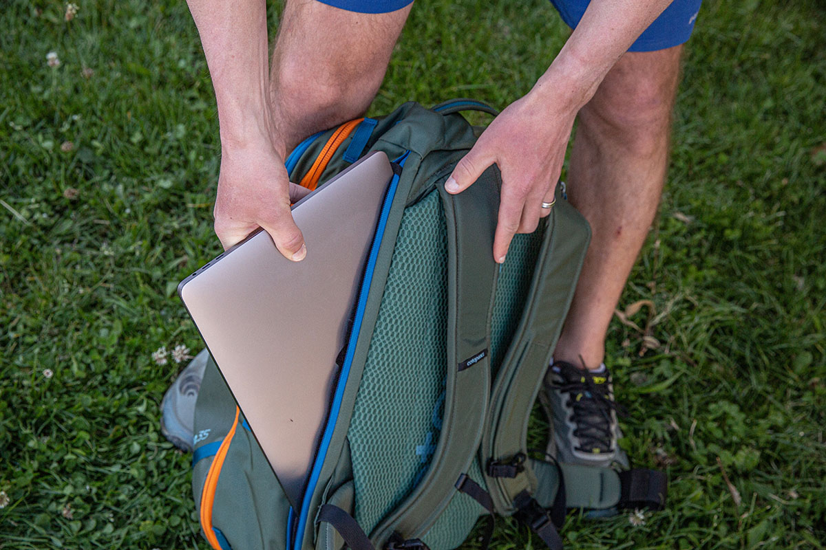 Travel backpack (pulling laptop out of the Cotopaxi Allpa)