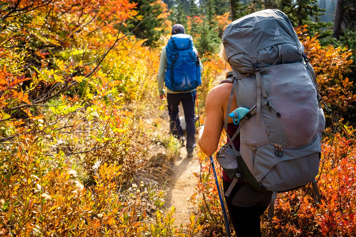 Women stay with Backpack with reusable water bottle in a pocket