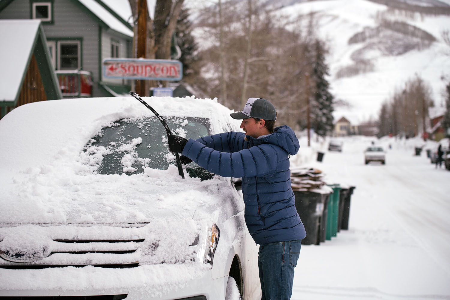 Winter jacket (Mountain Equipment Skyline cleaning off car)