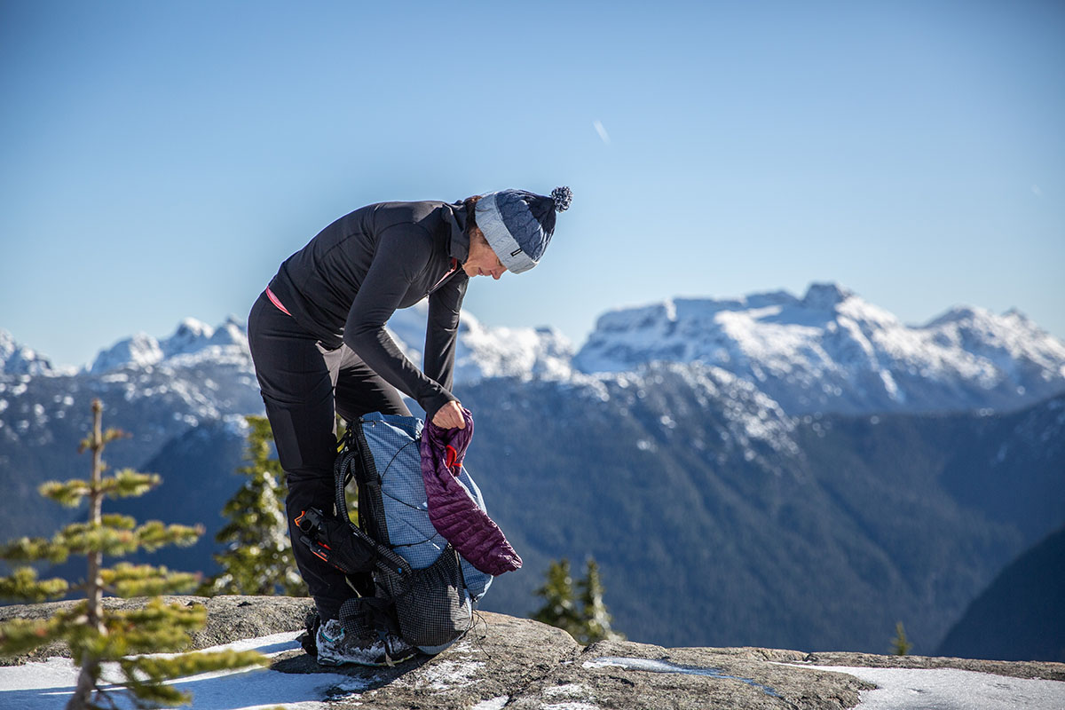 Women's baselayer (stuffing jacket into backpack)