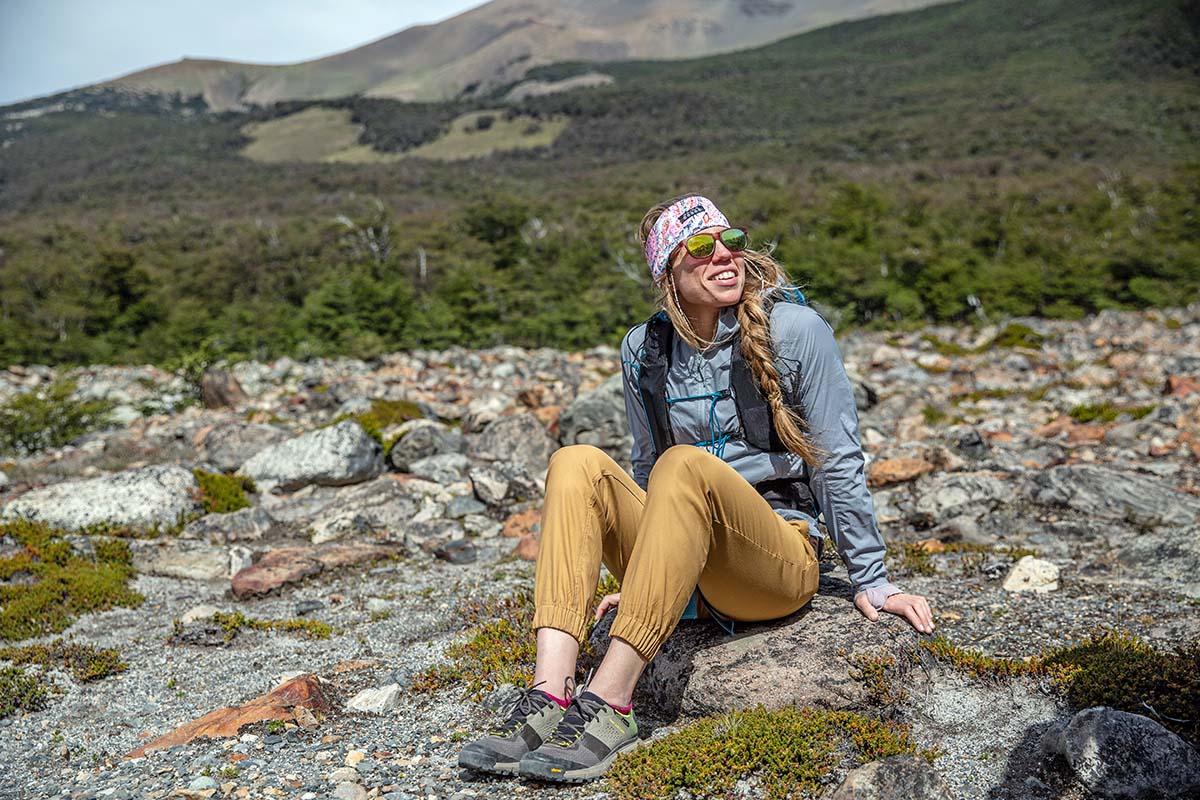 Sitting beside trail in women's hiking pants