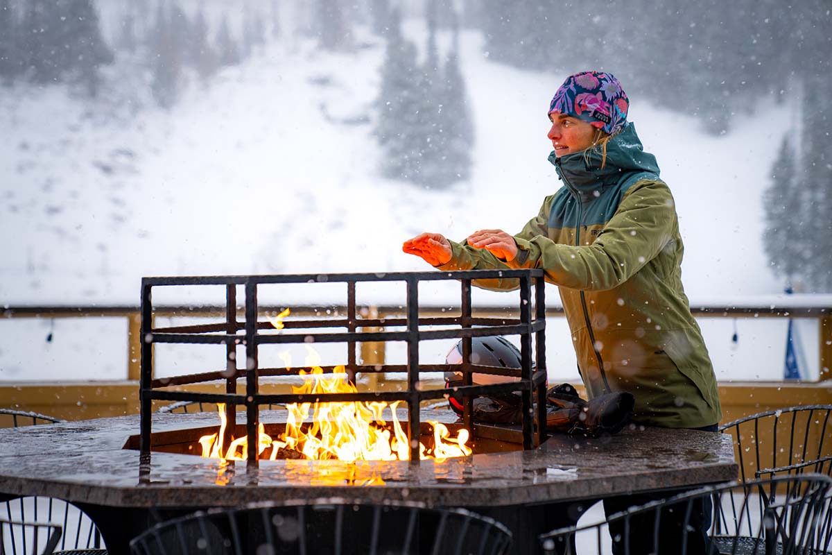 Standing by fire in the TREW Gear Astoria jacket