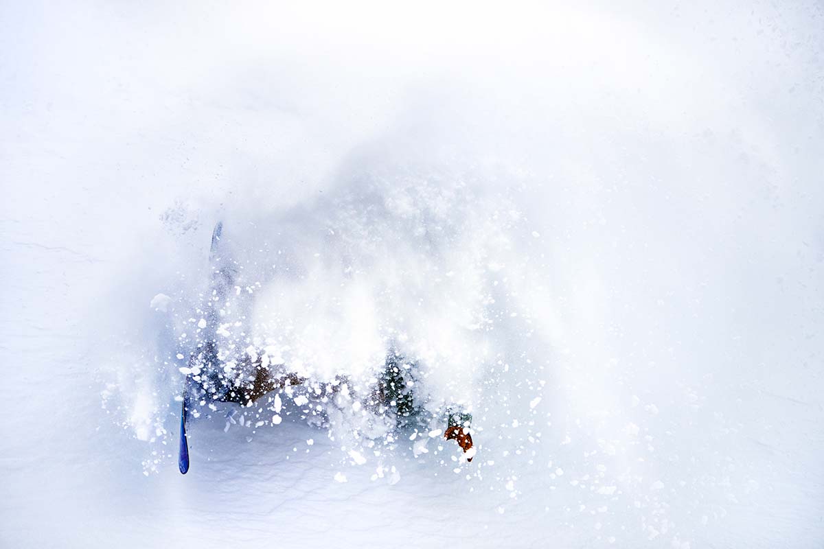 Wiping out in powder on a snowboard