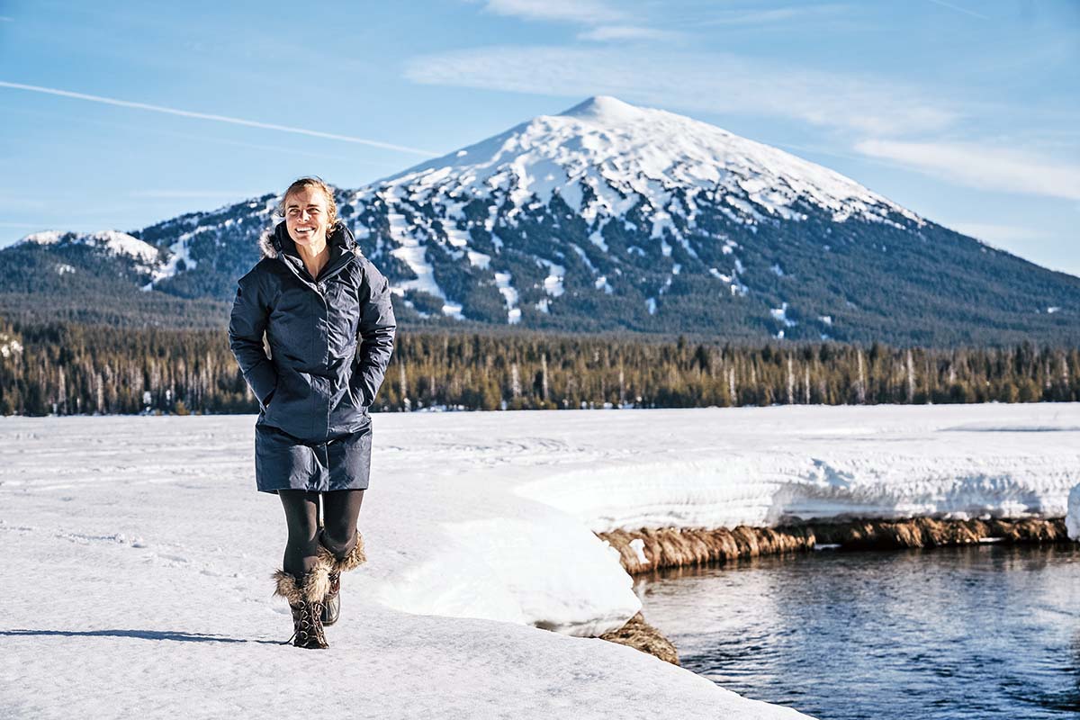 Winter jacket (The North Face Arctic Parka II hiking with mountain behind)