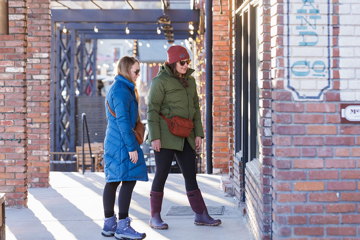 Women's winter jackets (wearing Patagonia Down With It and REI Stormhenge Parka around town)