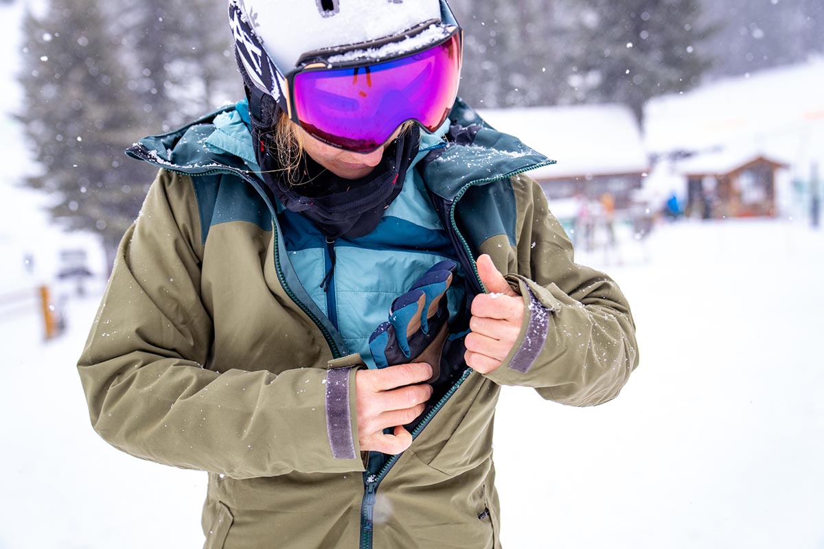 Ski trip packing list (putting gloves in ski jacket pocket)