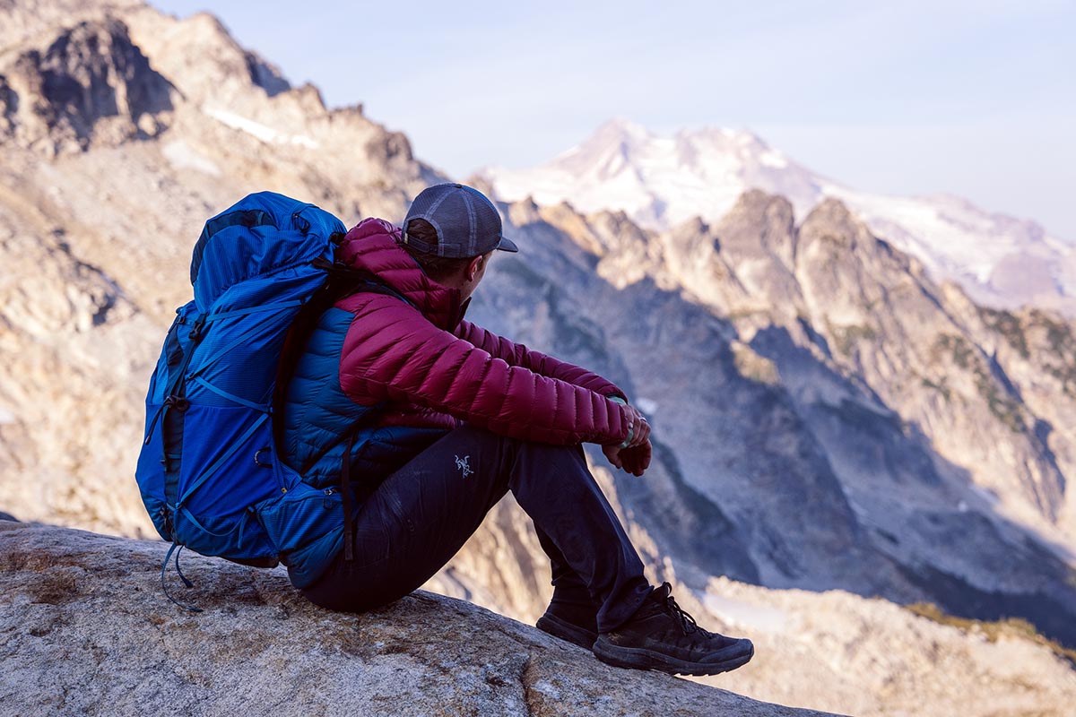 Arc'teryx Aerios FL 2 Mid hiking shoe (sitting on rock)