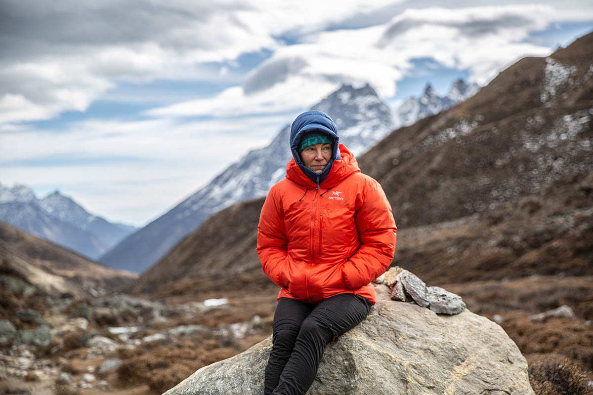 Arc'teryx Alpha Parka (sitting on rock in Nepal mountains)