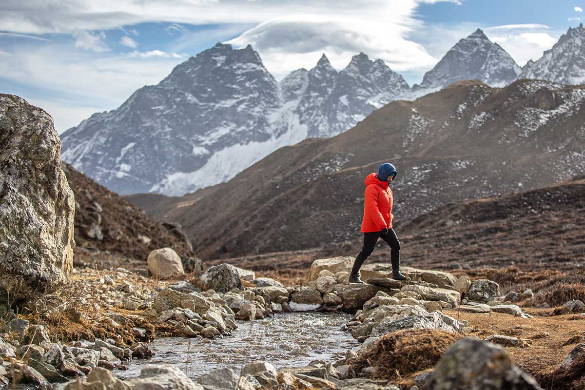 Arc'teryx Alpha Parka (walking across rocky stream)