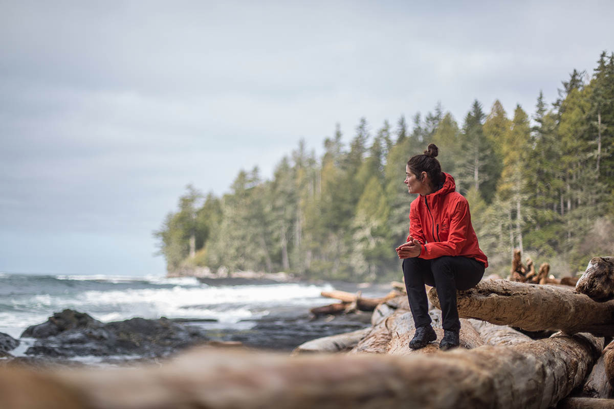 Arc'teryx Alpha SL Anorak (sitting on log along beach)