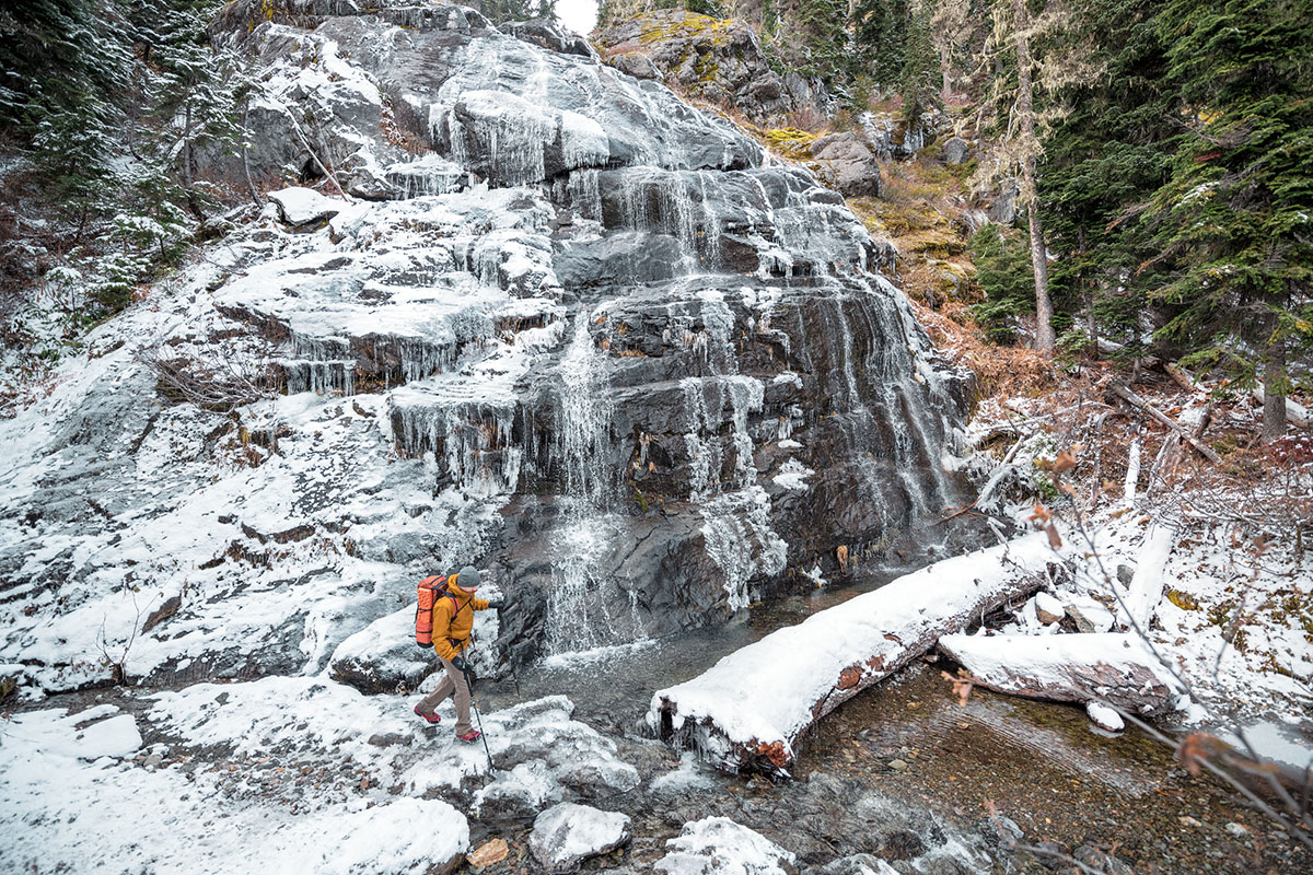 Arc'teryx Atom AR Hoody (crossing snowy stream)